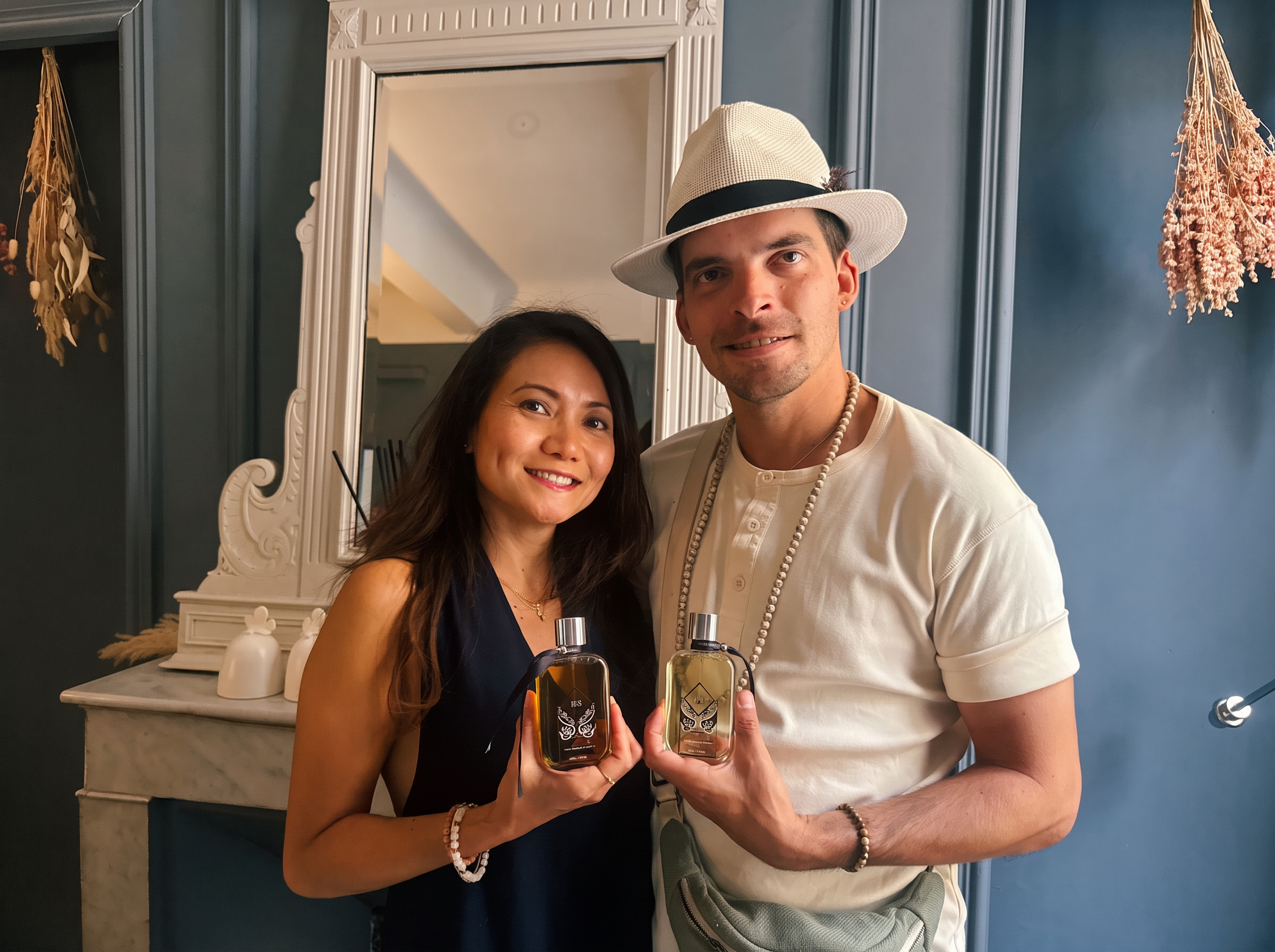 Bianca with a master perfumer in his atelier in Provence, holding bespoke fragrance creations
